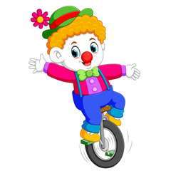 the boy uses the circus costume and standing on the unicycle