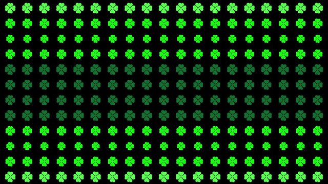 HD animation of clover particles fading in and out forming patterns vertically.