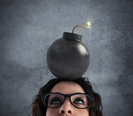 Businesswoman stunned by strong headache with a bomb over the head