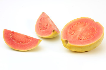 close-up guava fruit, pink, fresh, organic, with leaves, whole and sliced, isolated on white...