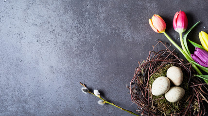 Eggs in the nest and flowers with copy space