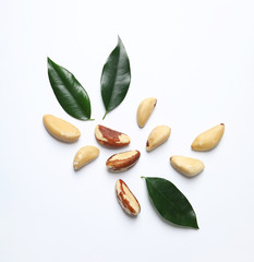 Composition with Brazil nuts on white background, top view