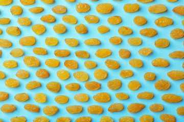 Flat lay composition with raisins on color background. Dried fruit as healthy snack