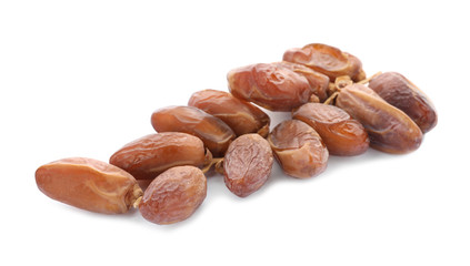 Sweet dates on branch against white background. Dried fruit as healthy snack