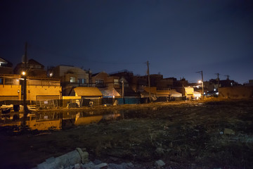 Fototapeta na wymiar Empty vacant urban city lots in Chicago at night