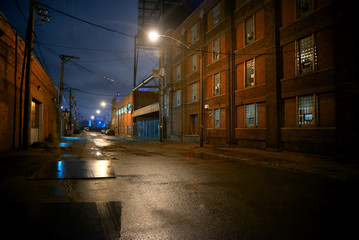 Dark and eerie industrial urban city street at night in Chicago