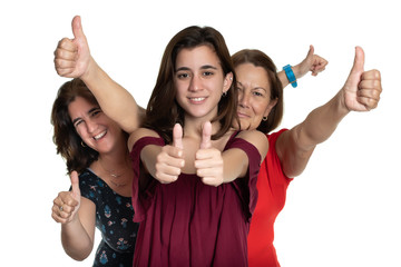 Three generations of latin women smiling and doing the thumbs up sign - On a white background