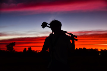 Fototapeta na wymiar Blurry subject Silhouette man in sunset on evening