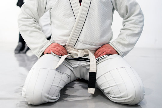 Brazilian Jiu JItsu BJJ WHite Belt Fighter Sitting in training