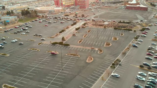 Flying over a parking lot towards heavy traffic in Albuquerque, NM.