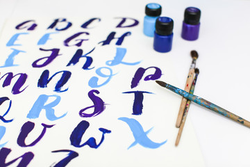 Calligraphy lettering alphabet drawn with dry brush. Letters of English ABC written with paint brush