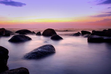 Fototapeta na wymiar Colorful sunset Seascape.Beautiful sunset with natural rocks salty water,Long exposure