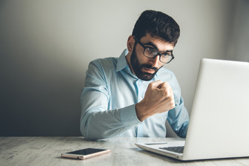 angry man working in computer