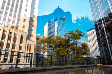Fototapeta na wymiar Bottom up view of Modern office building in Hong Kong