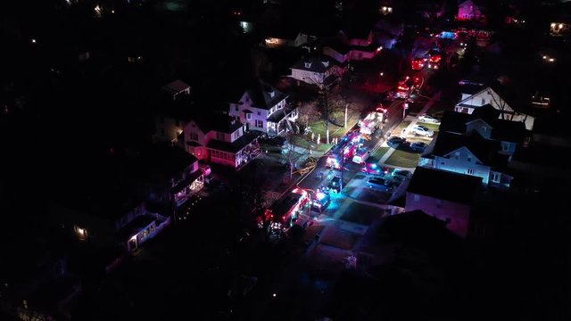 Aerial View of Fire Trucks and Apparatus on Scene of House Fire
