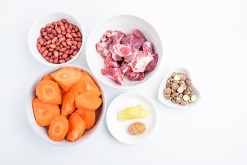 Preparing soup ingredients / pig bones