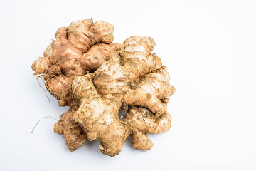 Mud with ginger on a white background