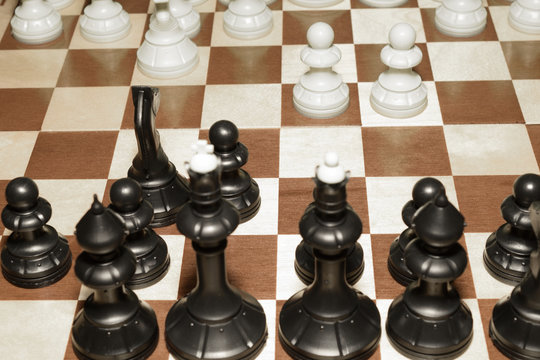 Wooden chess board and the pieces as a strategy concept
