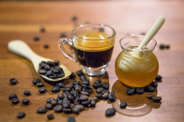 Honey jar and coffee cup and coffee beans