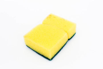Yellow scotch-brite isolated on a white background. Clean and wash concept.