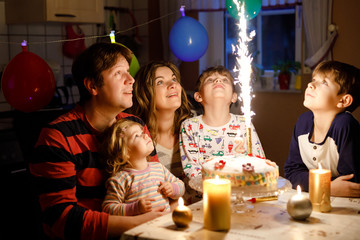 Adorable little toddler girl celebrating second birthday. Baby child, two kids boys brothers,...