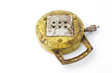 Dirty yellow outlet isolated on white background.
