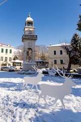 clock in Ioannina city in winter season snow ice Greece