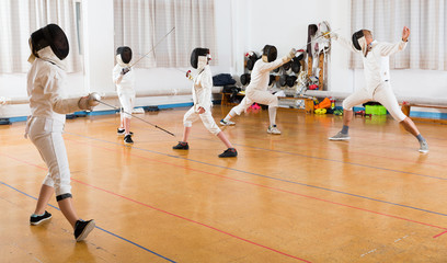 fencers  training attack movements in pair
