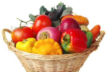 Vegetables in a basket. Pumpkins, tomatoes, onions, peppers. Isolated on white