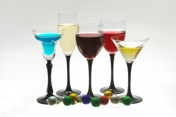 Five glasses of cocktail and masquerade masks