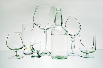 Broken wine glasses on a light background