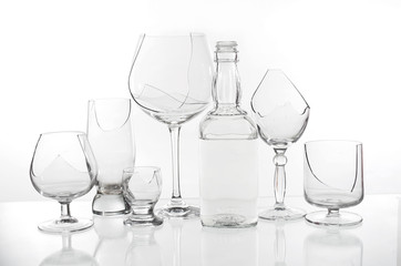 Broken wine glasses on a light background