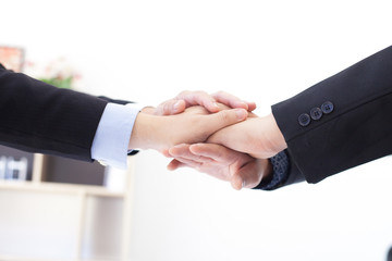 Business people join hands symbol of strong teamwork