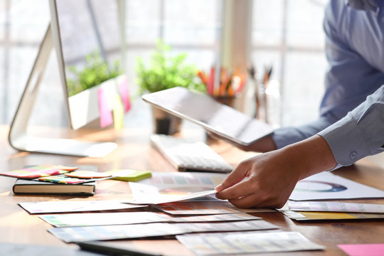 Graphic design working with  color swatches in studio