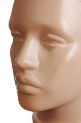Male plastic mannequin. Face. Close-up. On a white background