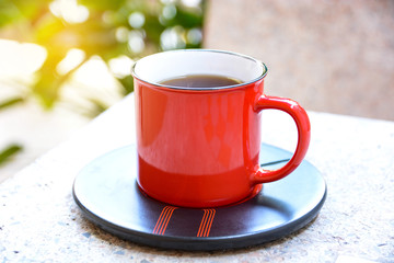 Red coffee mugs placed on the table