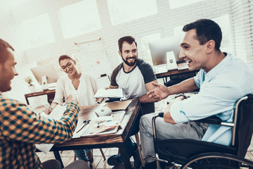Young Workers Have Discussion in Modern Office.