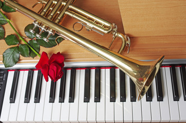 Trumpet, Red Rose and Piano Keyboard