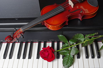 Violin, red rose and keyboard