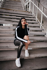 Cropped image of young disabled woman with prosthetic leg