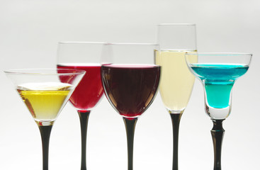 Five glasses with wines and cocktails