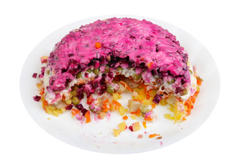 Scraps of New Year's handmade   herring with vegetables salad isolated