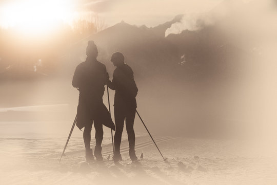 Simulations of old photography with artifacts. Cross-country skiing couple