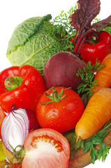Red tomatoes, carrots, beets, cabbage, onions. Isolated on white