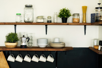 Dish on open shelves in kitchen