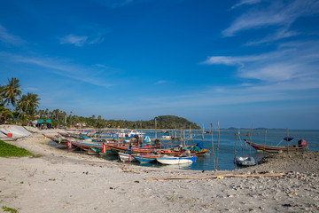 Fishing boats at the beach on Koh Samui in Thailand.