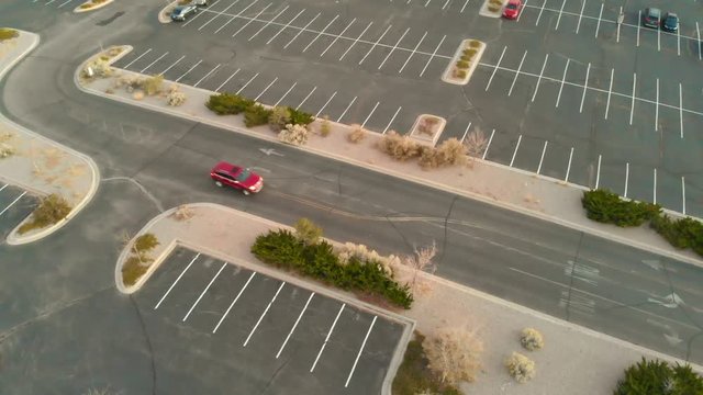 Drone shot panning with a traveling vehicle.