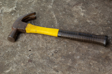 Top view of Working tools, hammer on floor background.