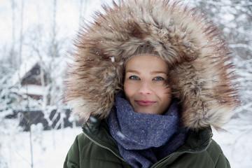 A young woman in warm clothes during winter