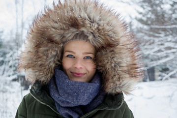 A young woman in warm clothes during winter